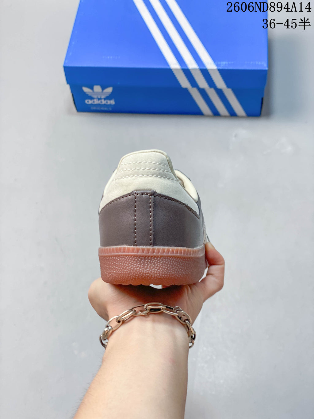 Rear view showing the brown heel panel and cream collar