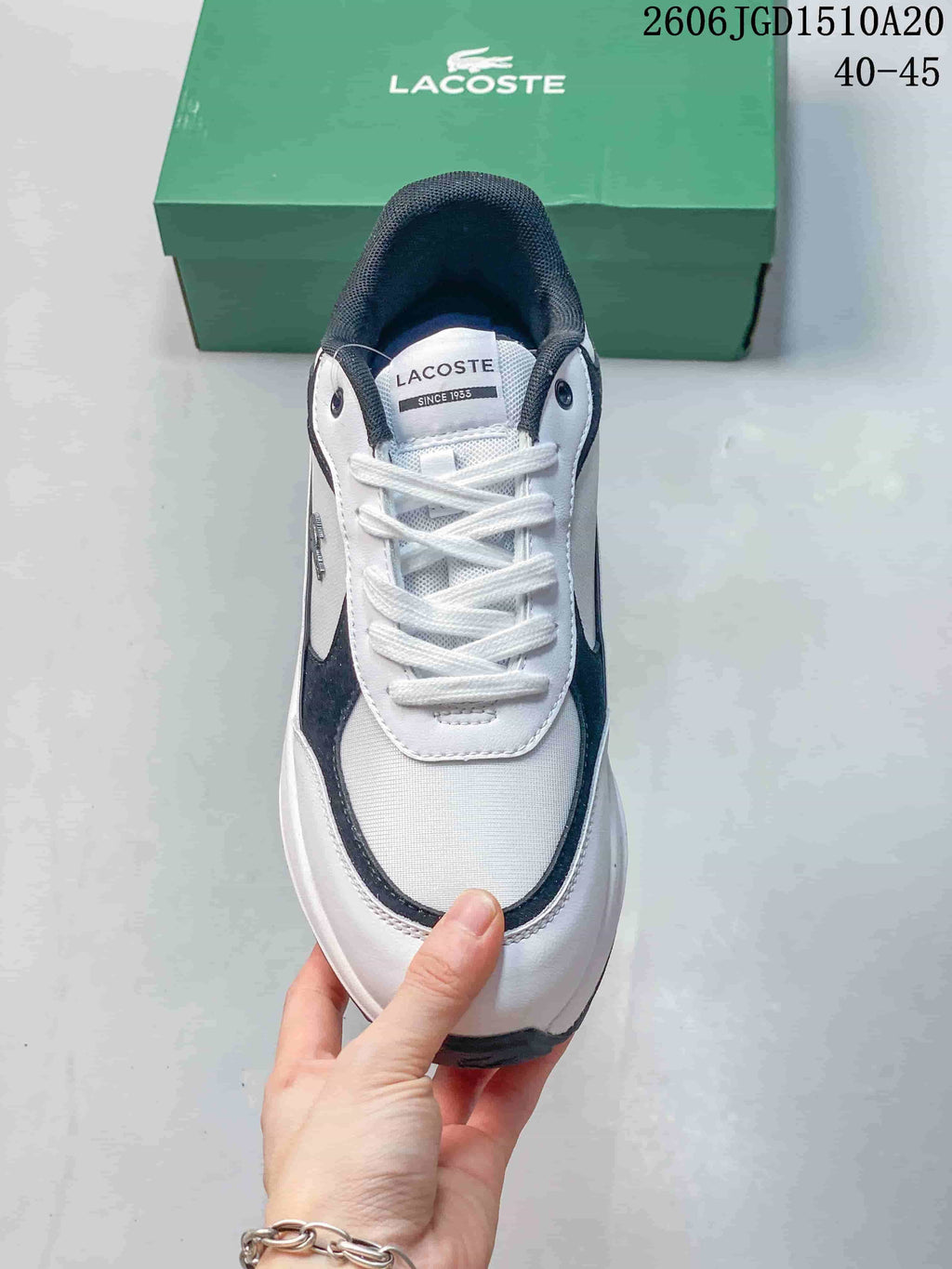Top view of the sneaker showing its white laces and layered upper