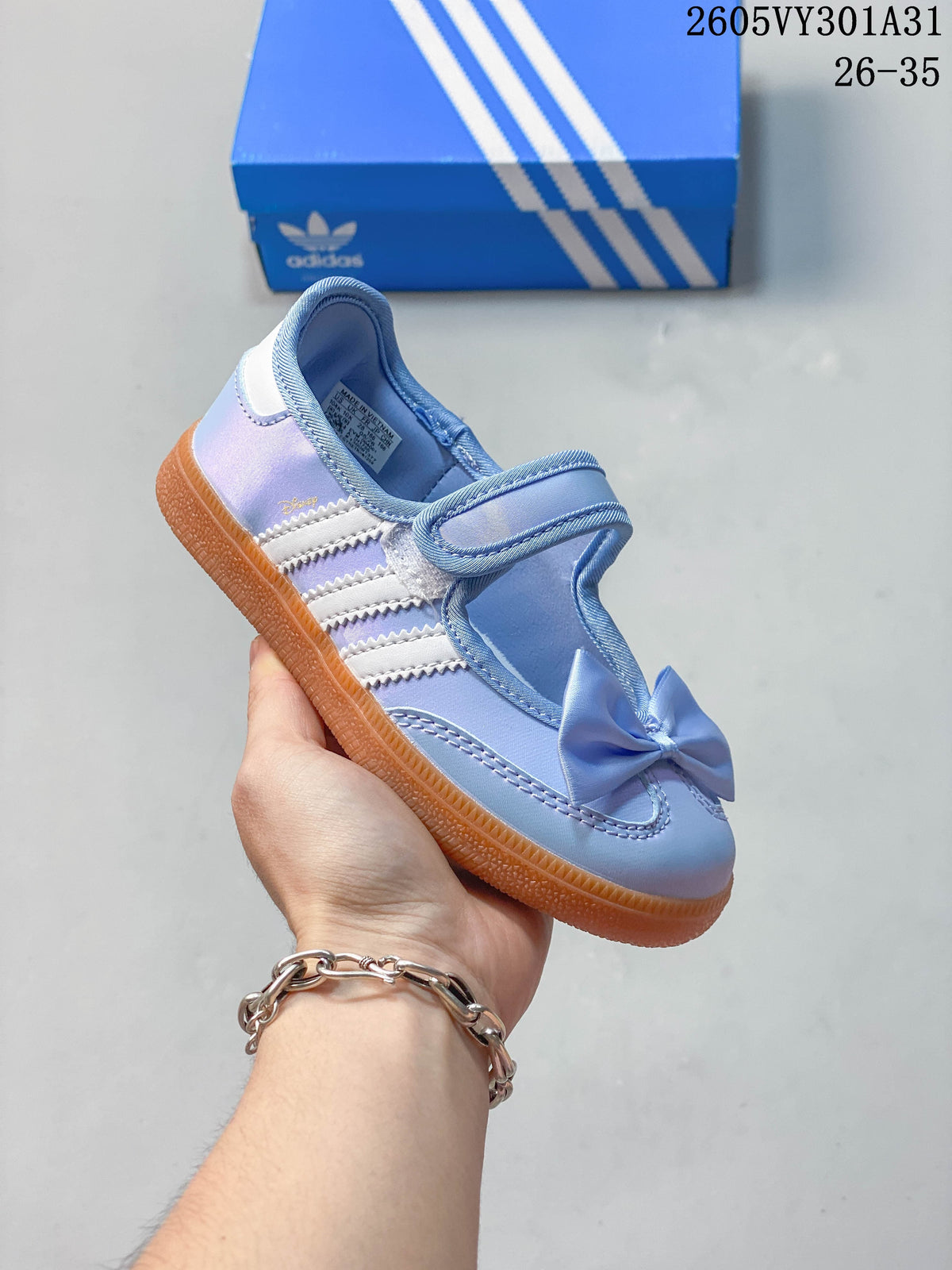 Blue kids’ Samba Jane shoe with a bow and gum-colored outsole