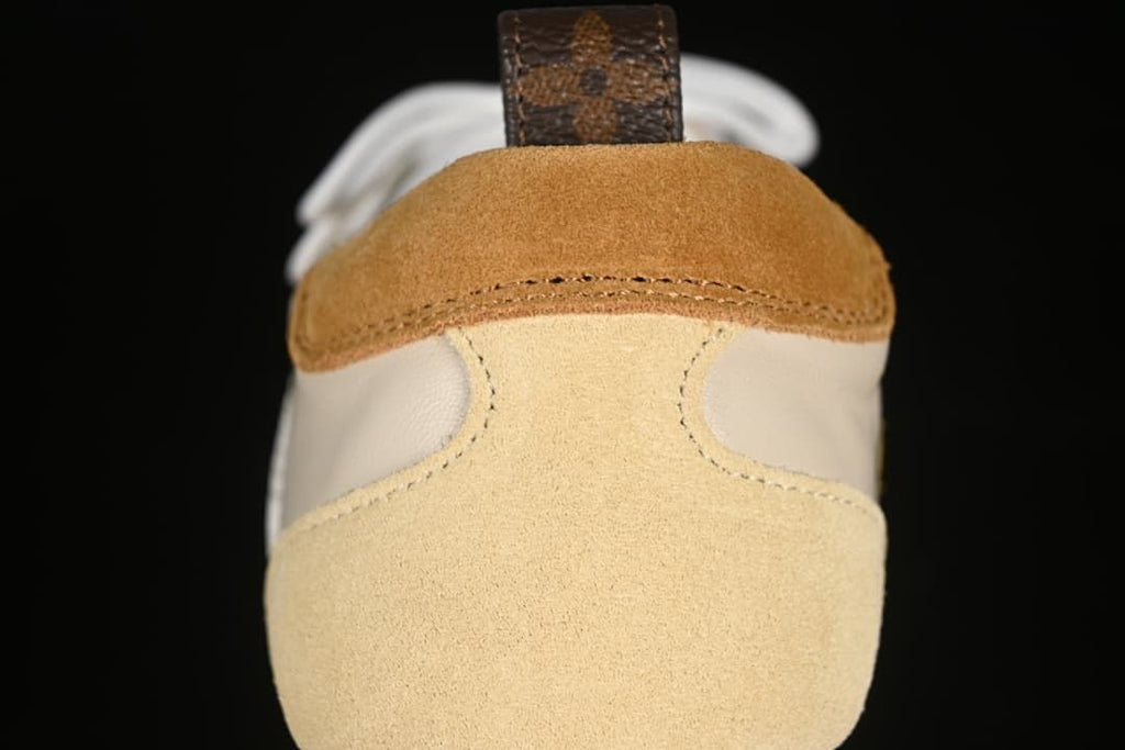 Rear view showing beige suede-look heel panels and brown heel accents