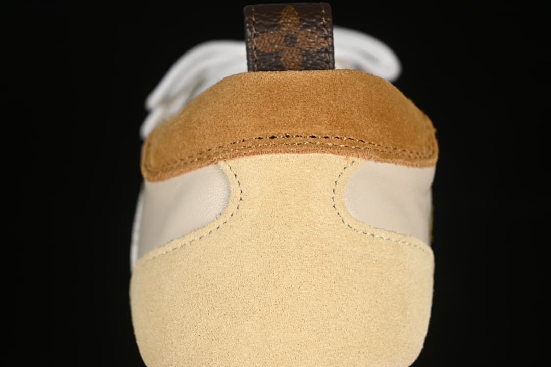 Rear view showing beige suede-look heel panels and brown heel accents