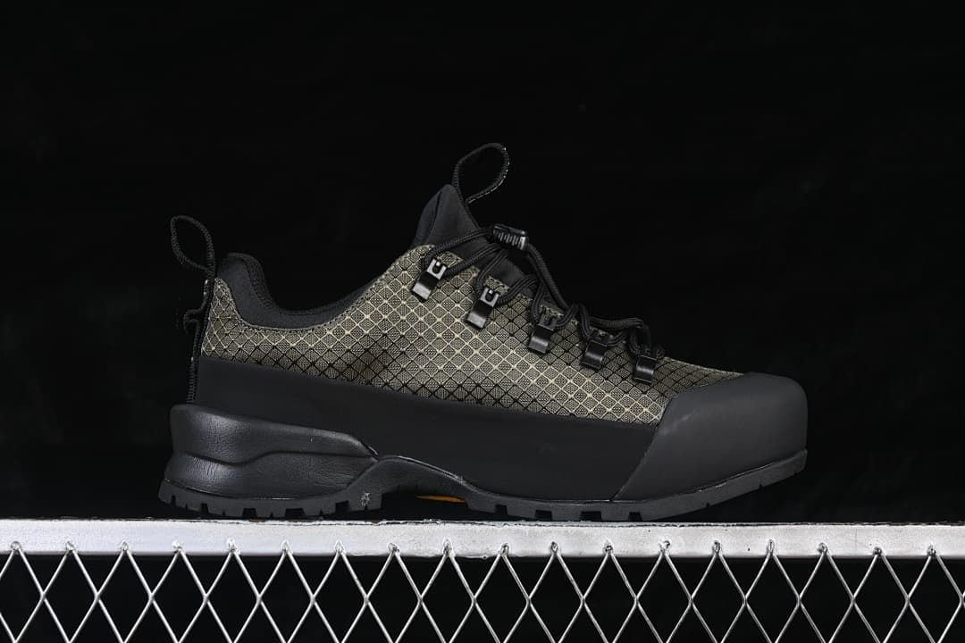 Side profile of the low-cut shoe with patterned upper and black overlays