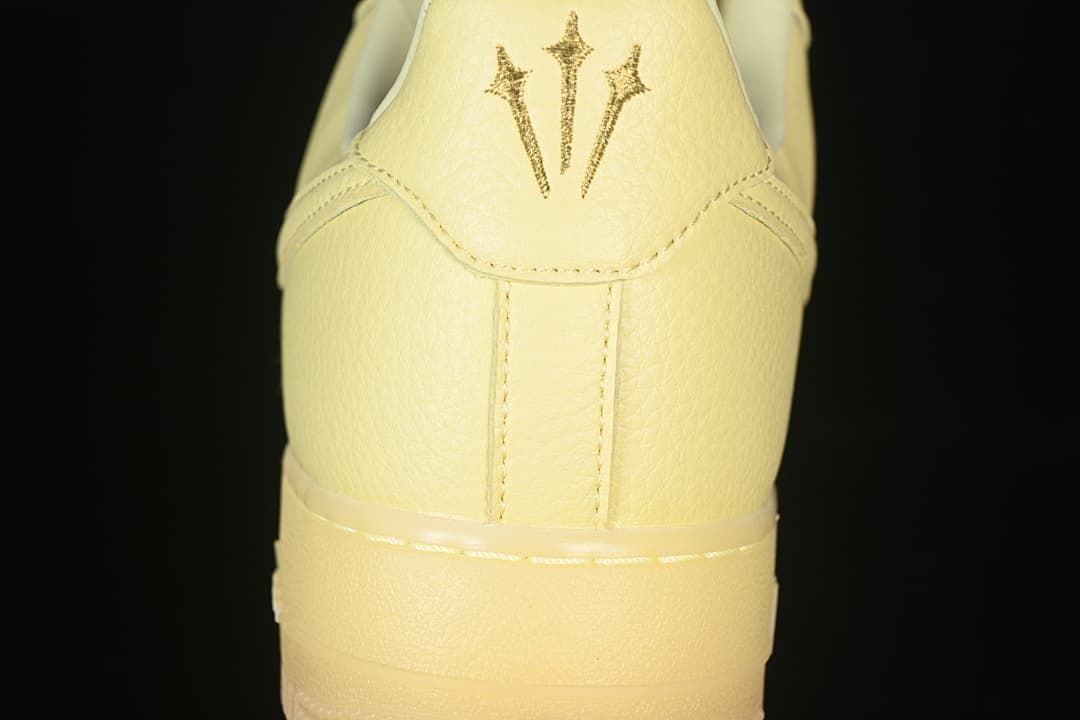 Heel close-up showing decorative embroidered markings