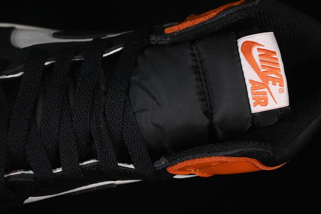 Close-up of black laces and tongue label