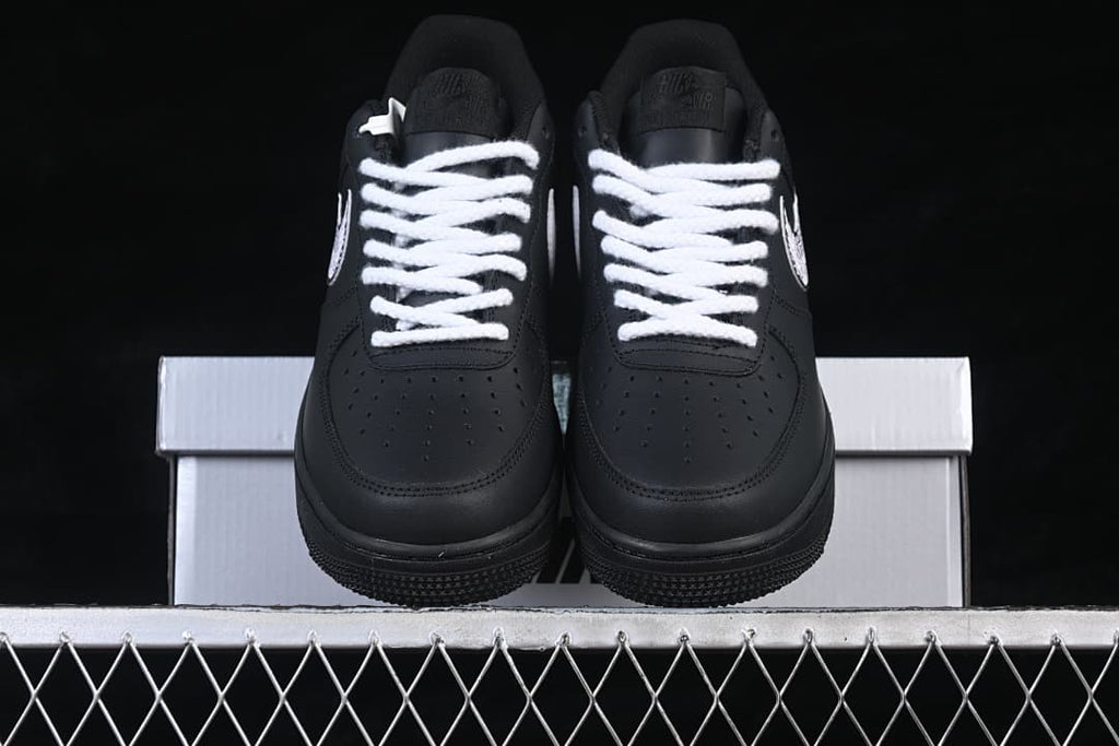 Front view of the pair showing perforated toes and white laces