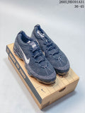 Pair of dark navy Nike Air VaporMax 2023 Flyknit shoes on a shoebox