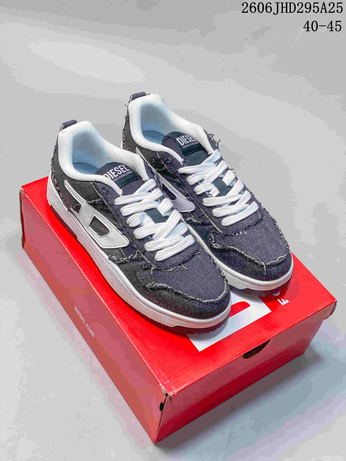Pair of dark gray distressed denim-look low-top sneakers on a red shoebox