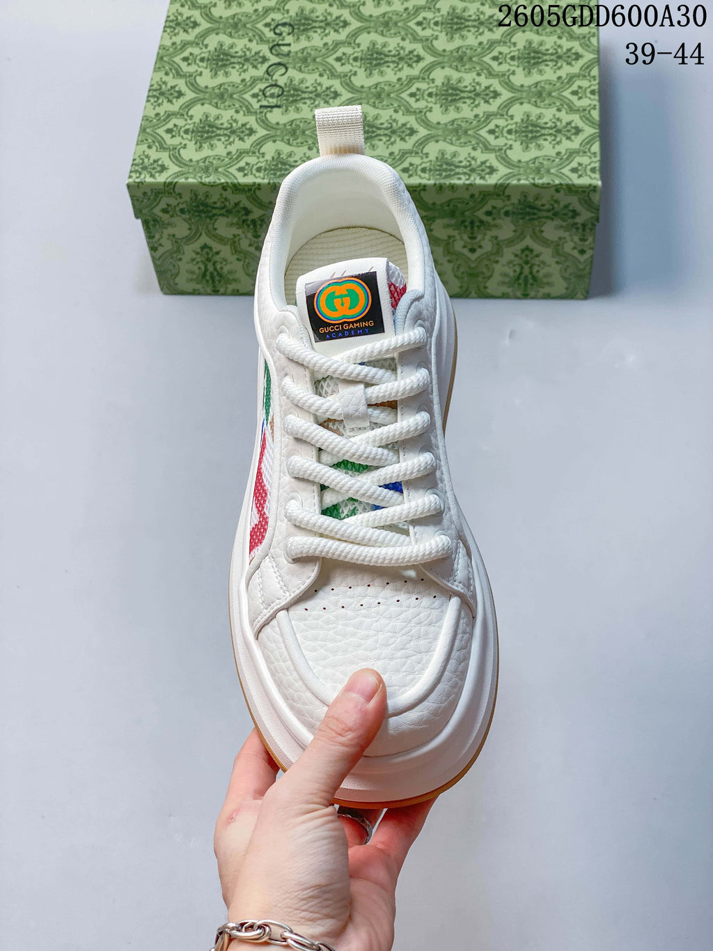 Top view showing white laces, perforated toe, and multicolor side detailing.