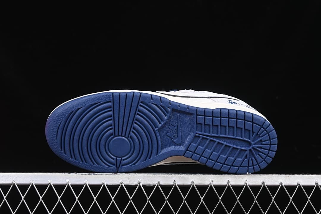 Underside view showing the navy rubber outsole tread.