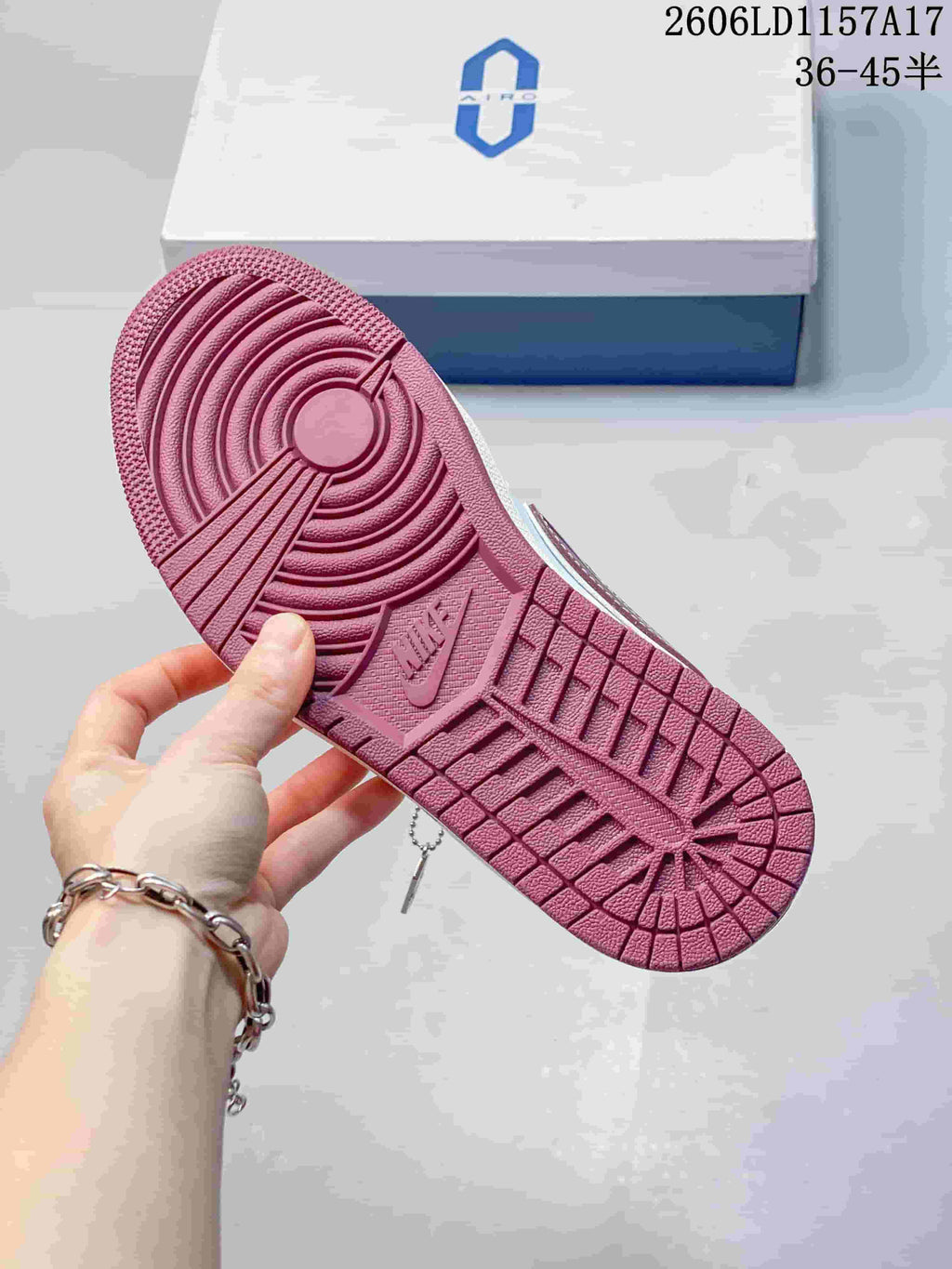 Burgundy rubber outsole with circular tread pattern