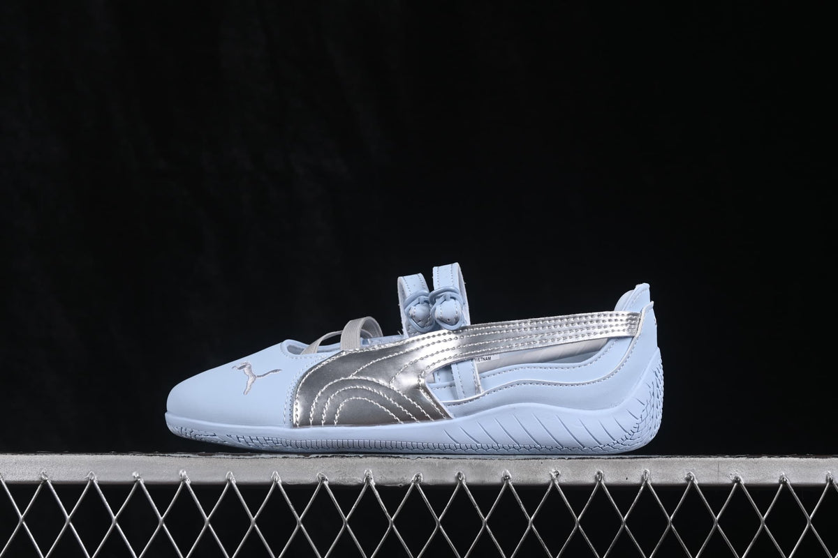 Side profile highlighting the silver metallic panel, stitching and textured heel outsole.