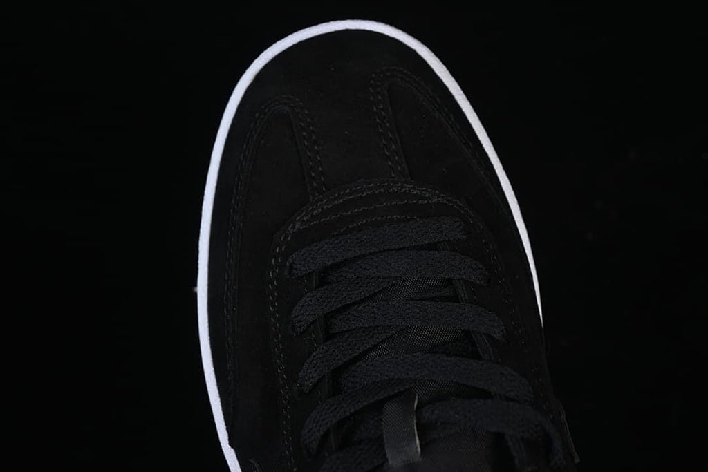 Top-down detail of the black toe and lace area.