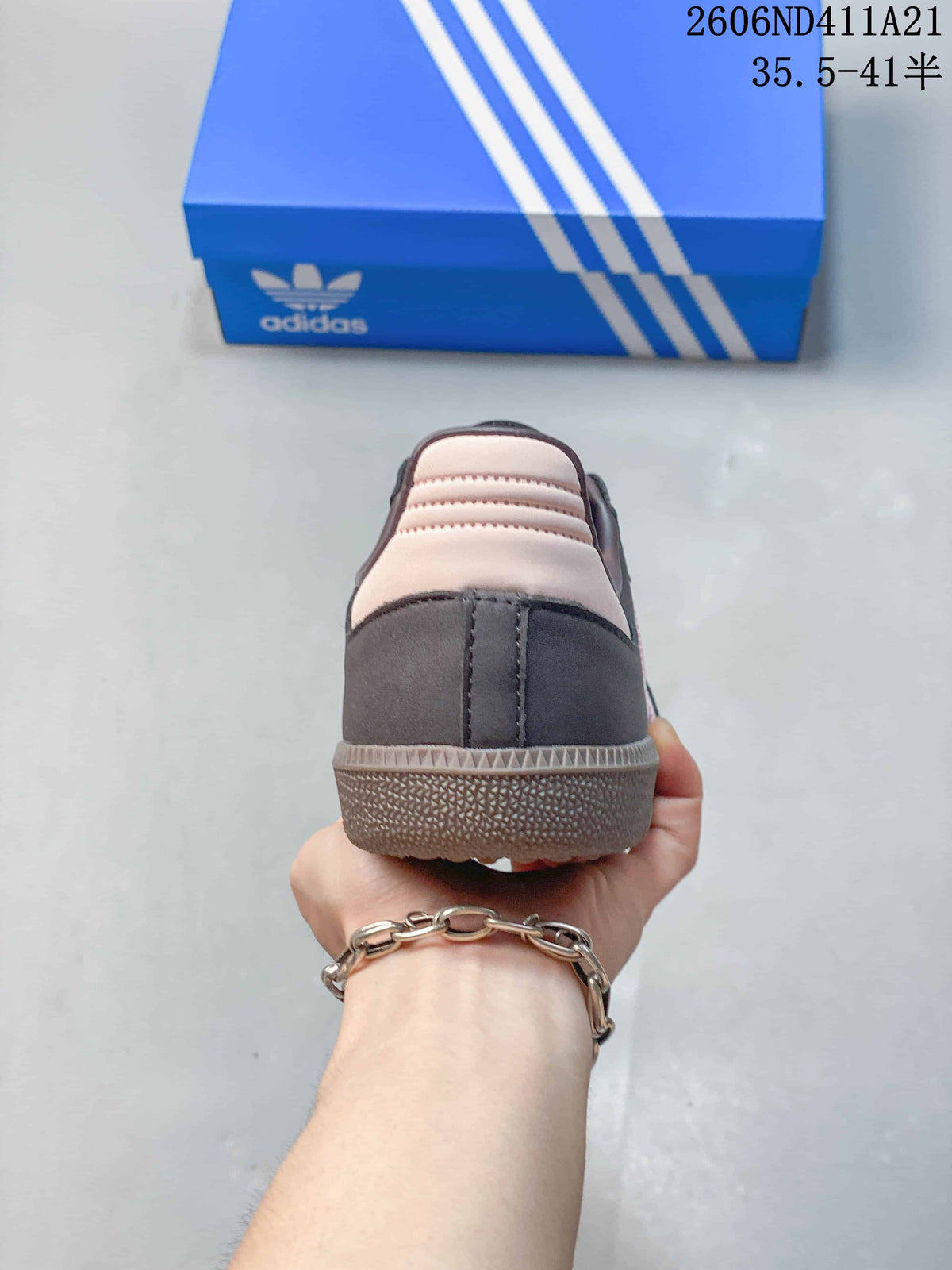 Rear view showing the charcoal heel and pale pink heel accent.
