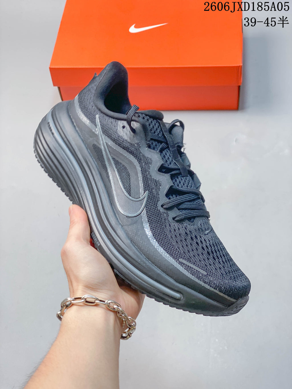 Side view of a dark gray Nike Winflo 12 running shoe.
