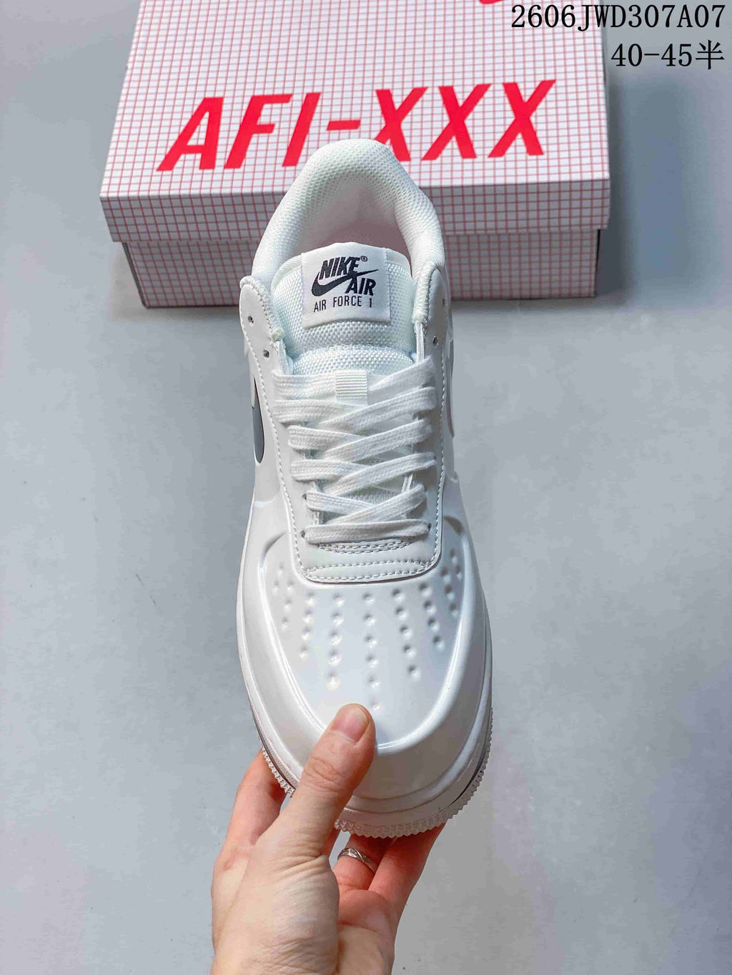 Top view showing the laces, tongue branding, and perforated toe box.
