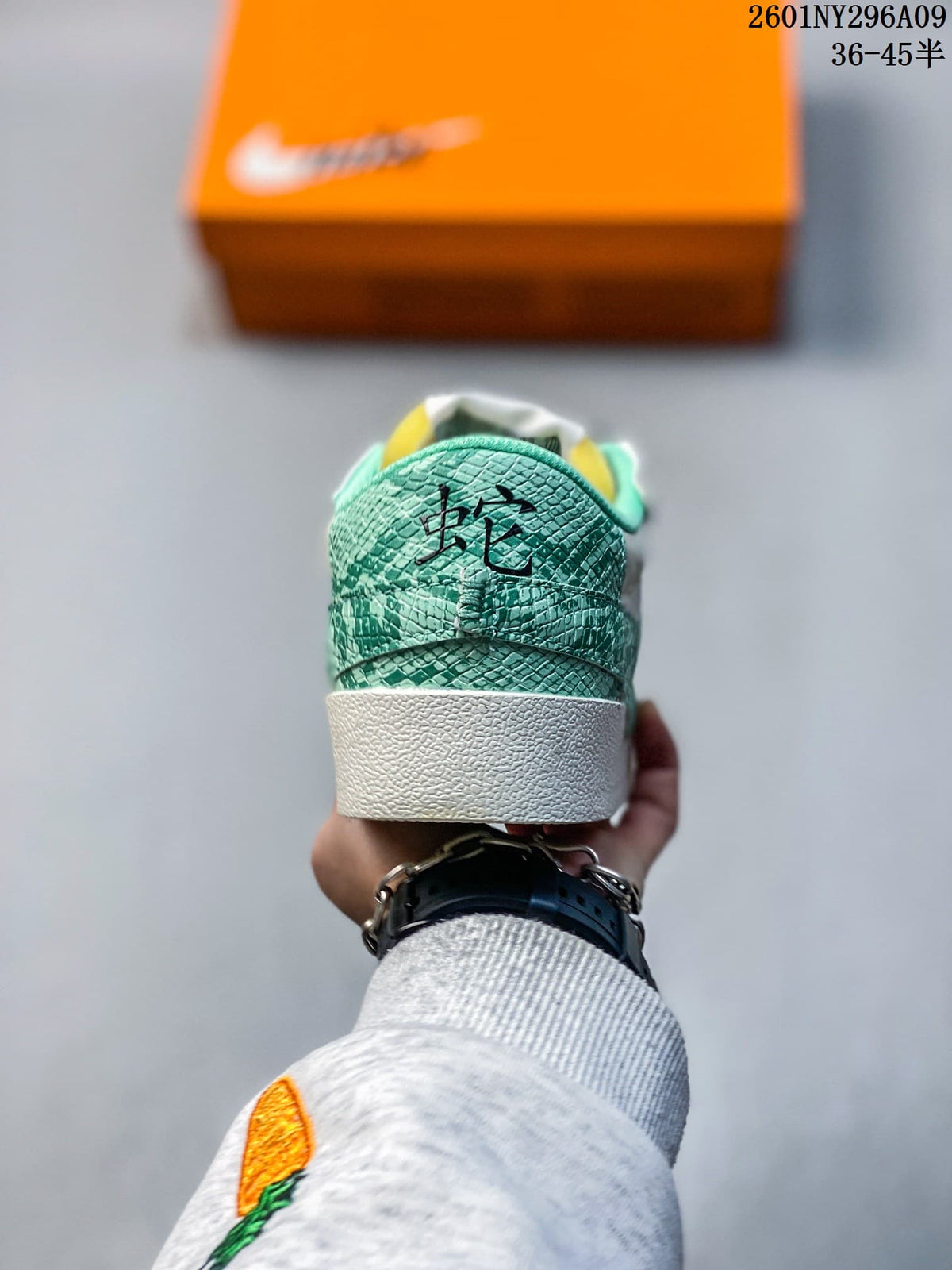 Rear view of the sneaker with a green patterned heel panel.