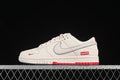 Side view of a cream and red low-top sneaker with a contrasting outlined Swoosh and Supreme-branded side detail.