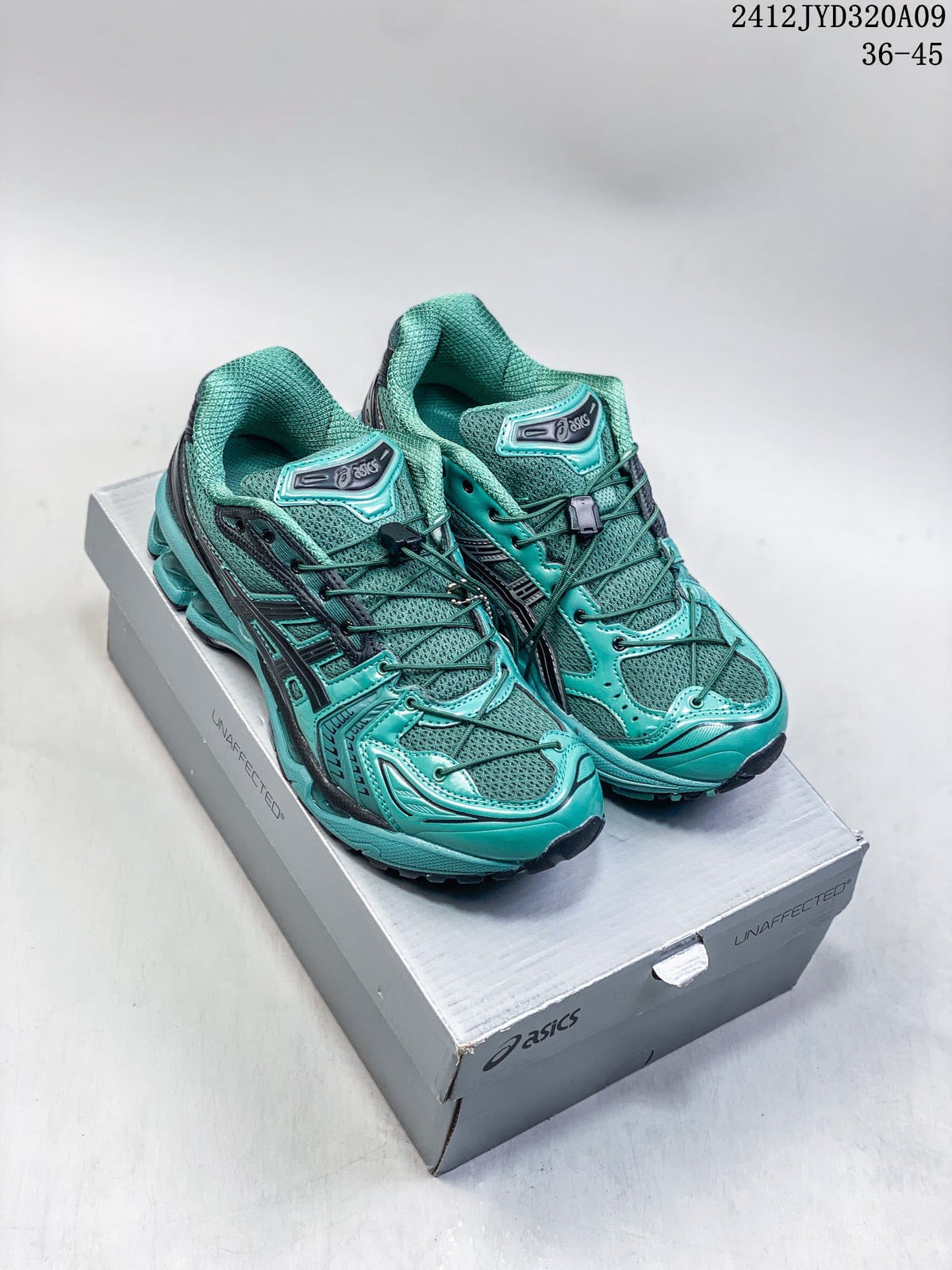 Pair of teal and dark gray ASICS GEL-KAYANO 14 sneakers on a shoebox; image text shows 36–45 and 2412JYD320A09.