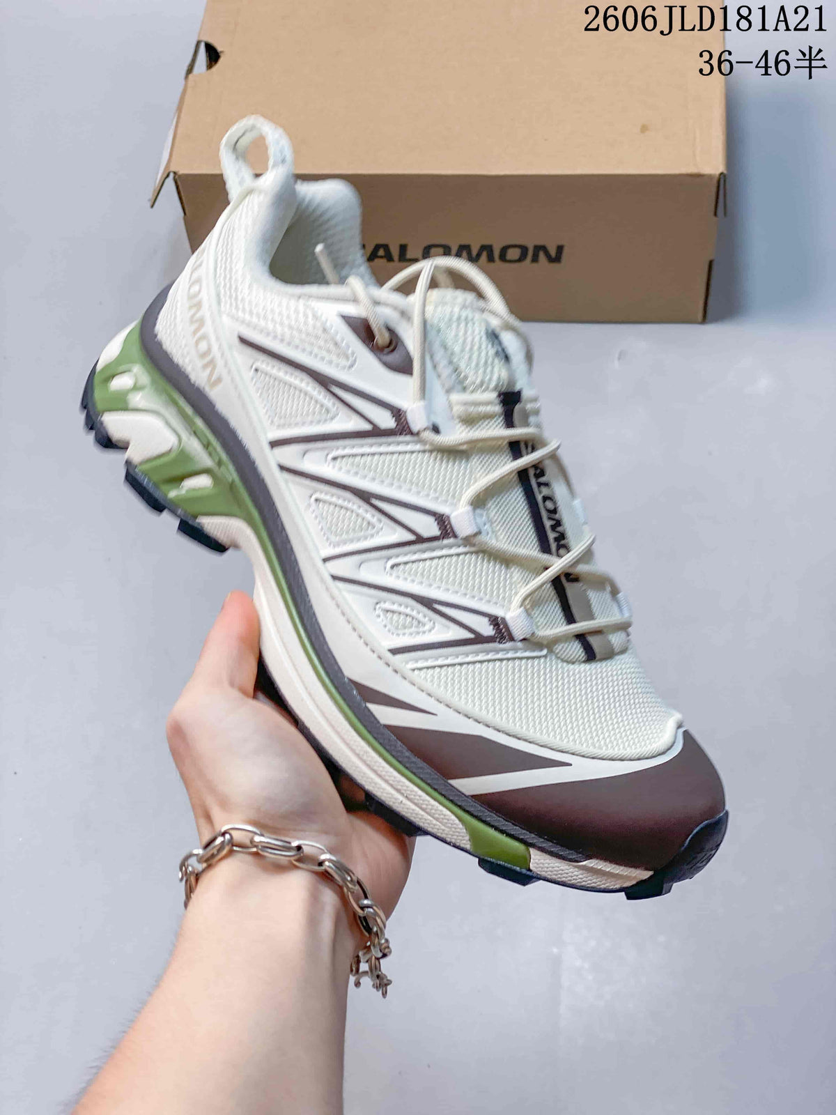 Angled side view of the sneaker with its layered design and lugged outsole.
