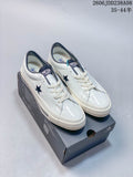 Pair of white Converse One Star low-top sneakers with dark star accents, shown on a shoe box