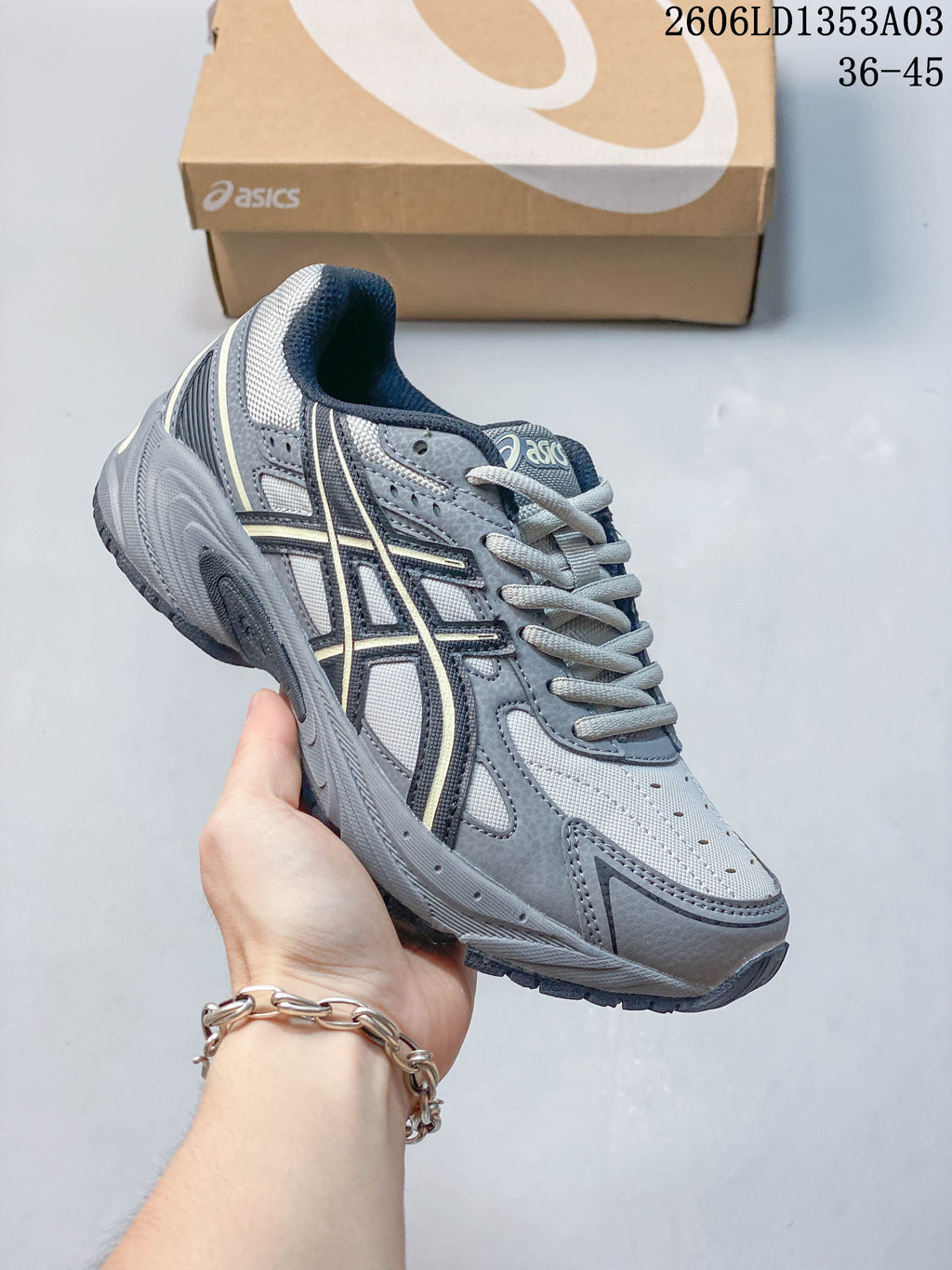 Angled side view of the grey ASICS GEL-170TR sneaker.