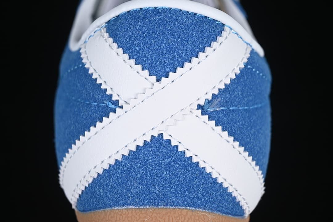Close-up of the blue heel with crossed white accents