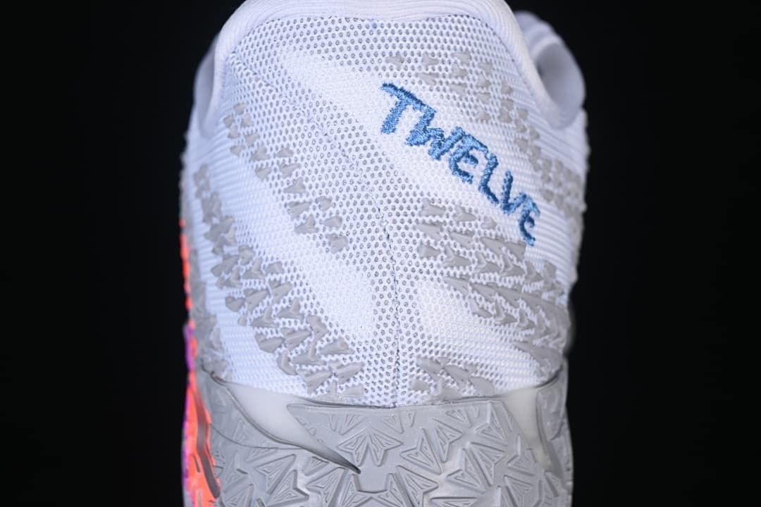 Heel view with patterned upper and blue lettering