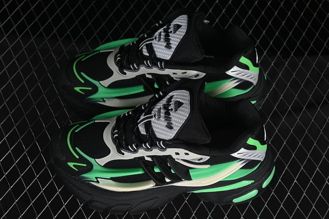 Pair of black, green and off-white Adistar Jellyfish sneakers viewed from above