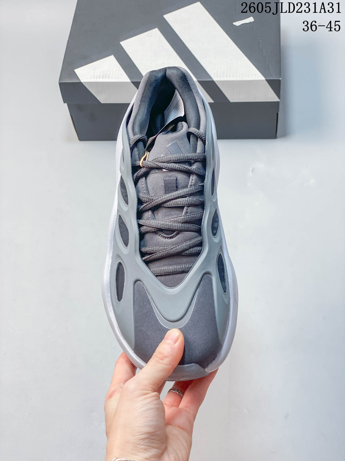 Top view of a grey Adidas Hyperboost sneaker showing the laces, padded collar, and rounded toe.