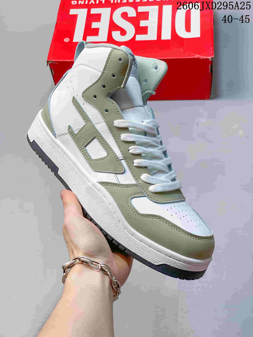 White Diesel S-Ukiyo high-top sneaker with muted green accents.