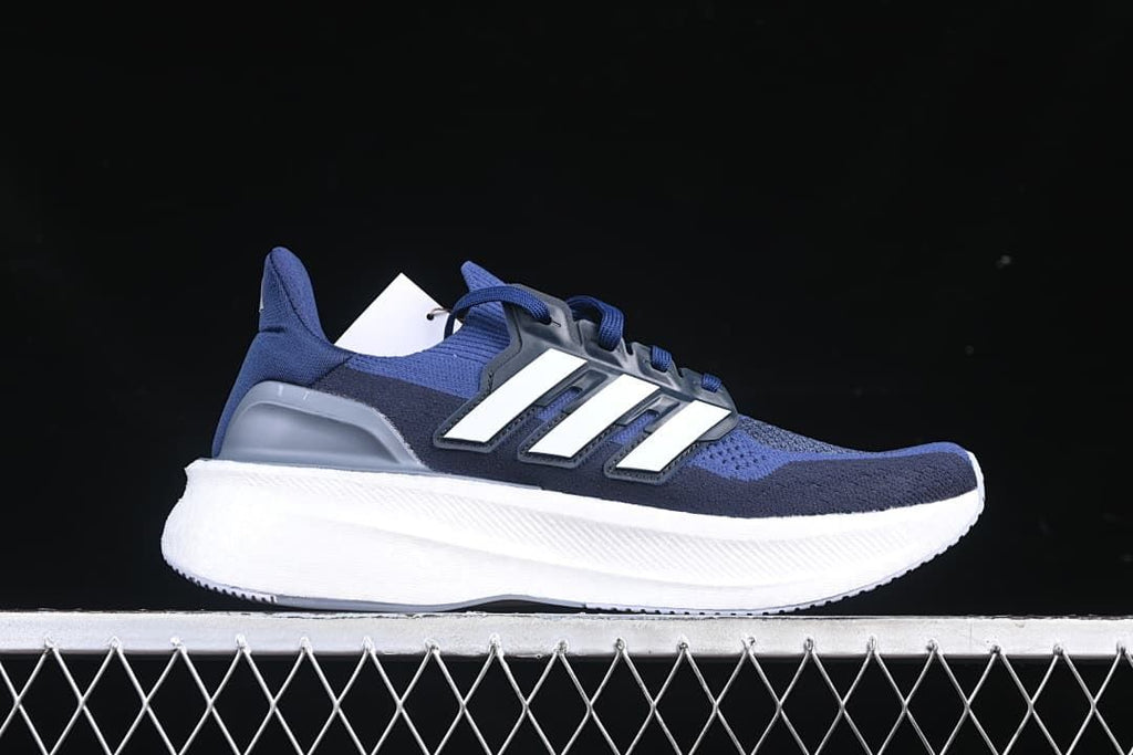 Side profile of the blue shoe with white stripes and white midsole.