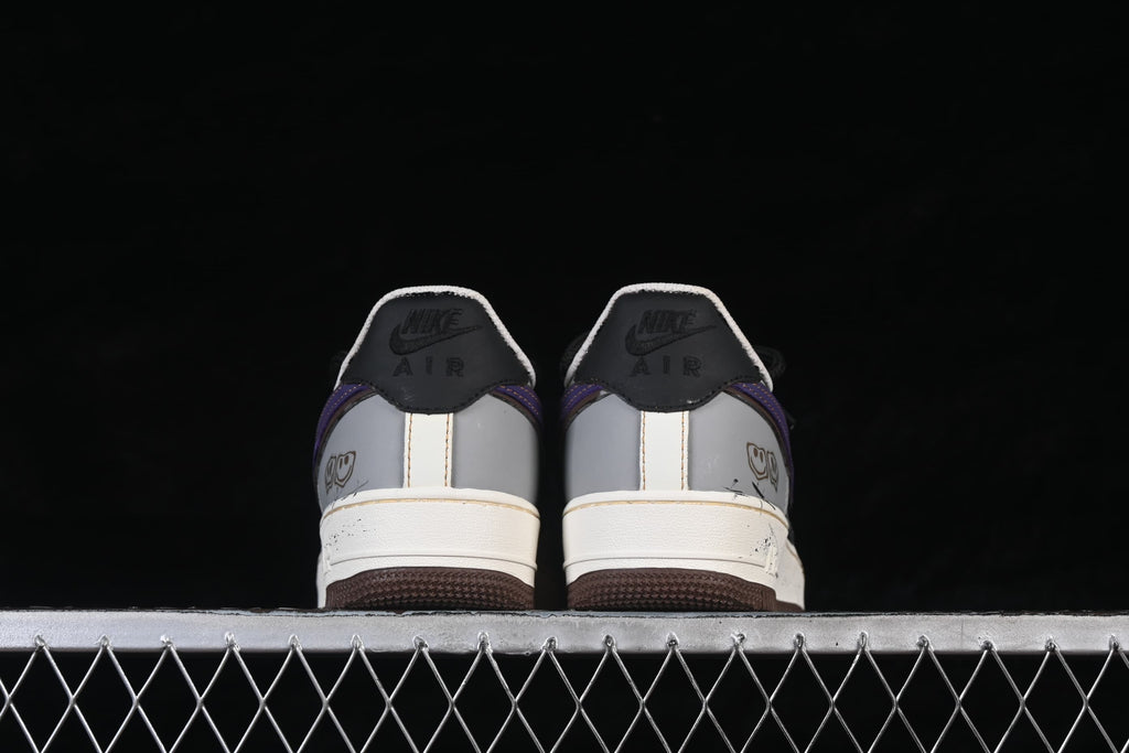 Rear view of the pair showing heel panels and brown outsoles