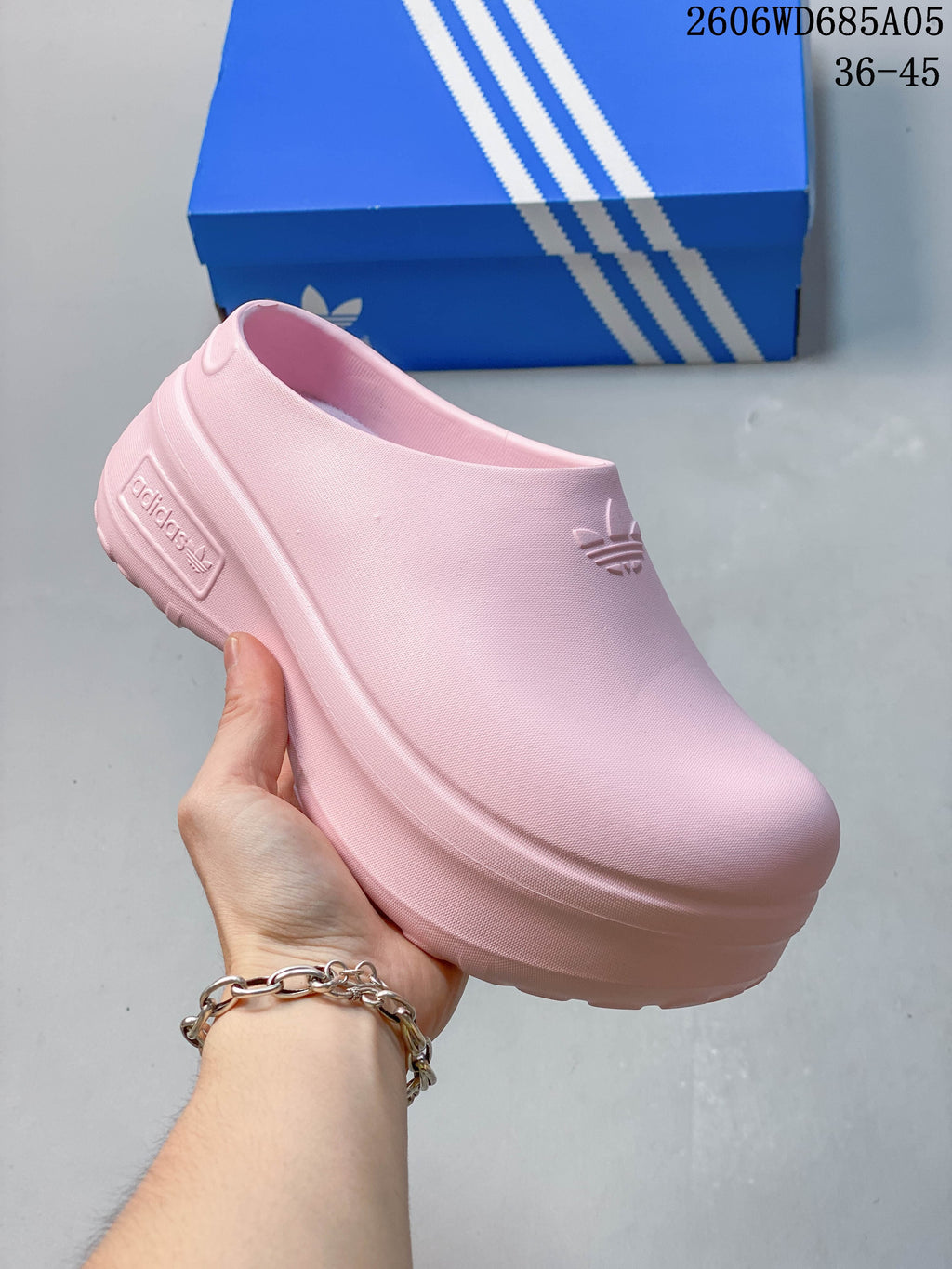 Turquoise Adidas mule clog with embossed branding