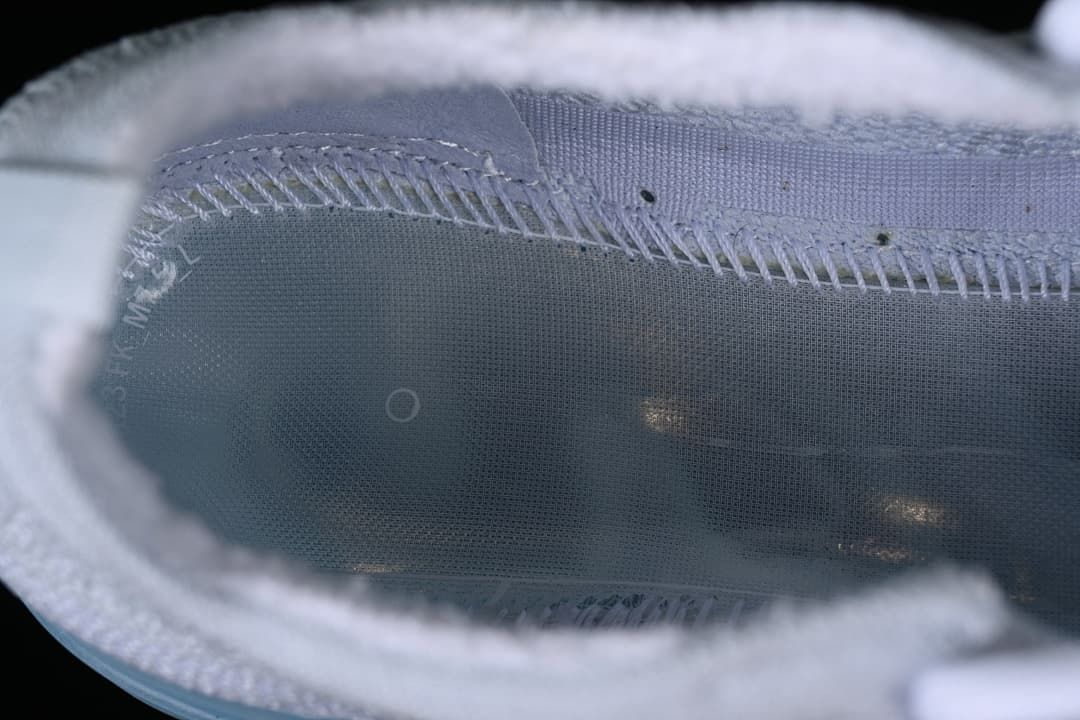 Close-up view inside the sneaker showing its lining and stitching