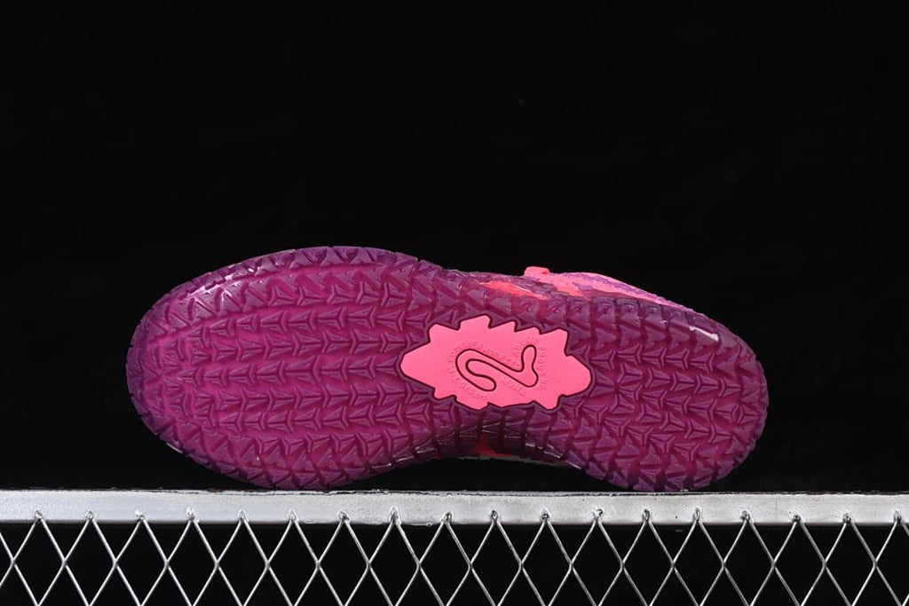 Bottom view showing the textured purple outsole and central pink detail
