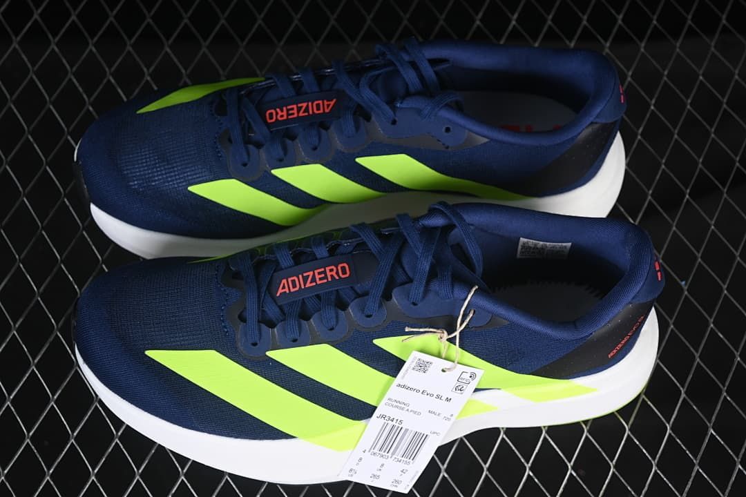 Pair of navy and lime Adizero Evo SL running shoes.