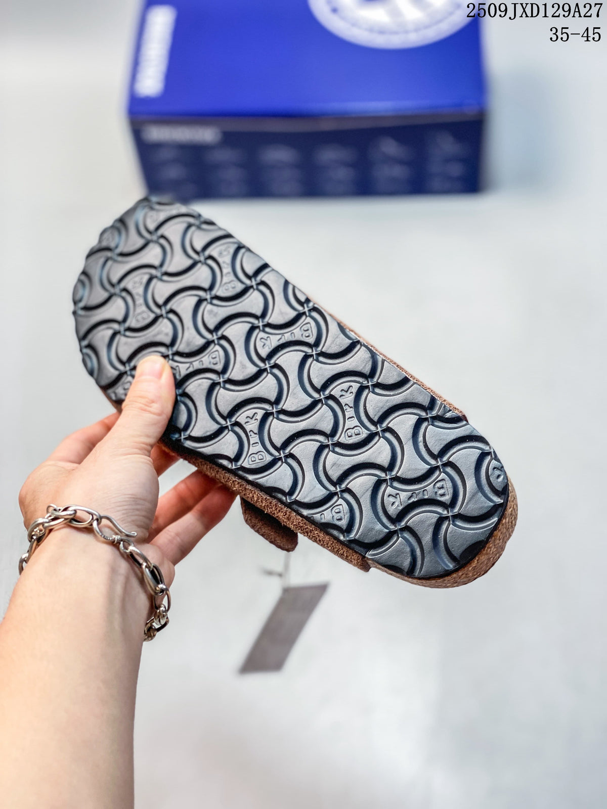 Close-up of the patterned outsole on a brown clog