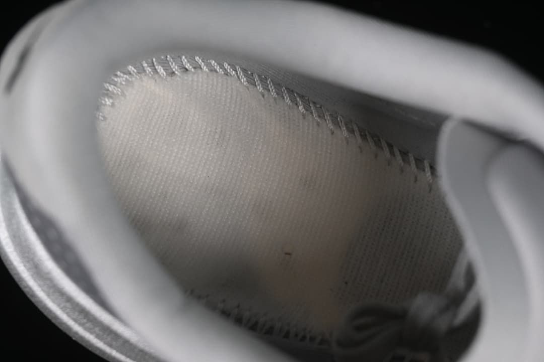 Close-up view inside the shoe, showing the lining and stitching.