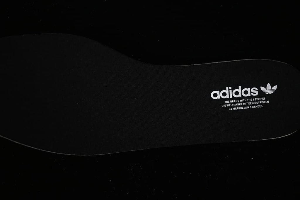 Black insole with adidas Trefoil branding