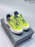 Pair of neon yellow, white, navy, and purple Kailas FUGA EX3 trail running shoes on a shoebox