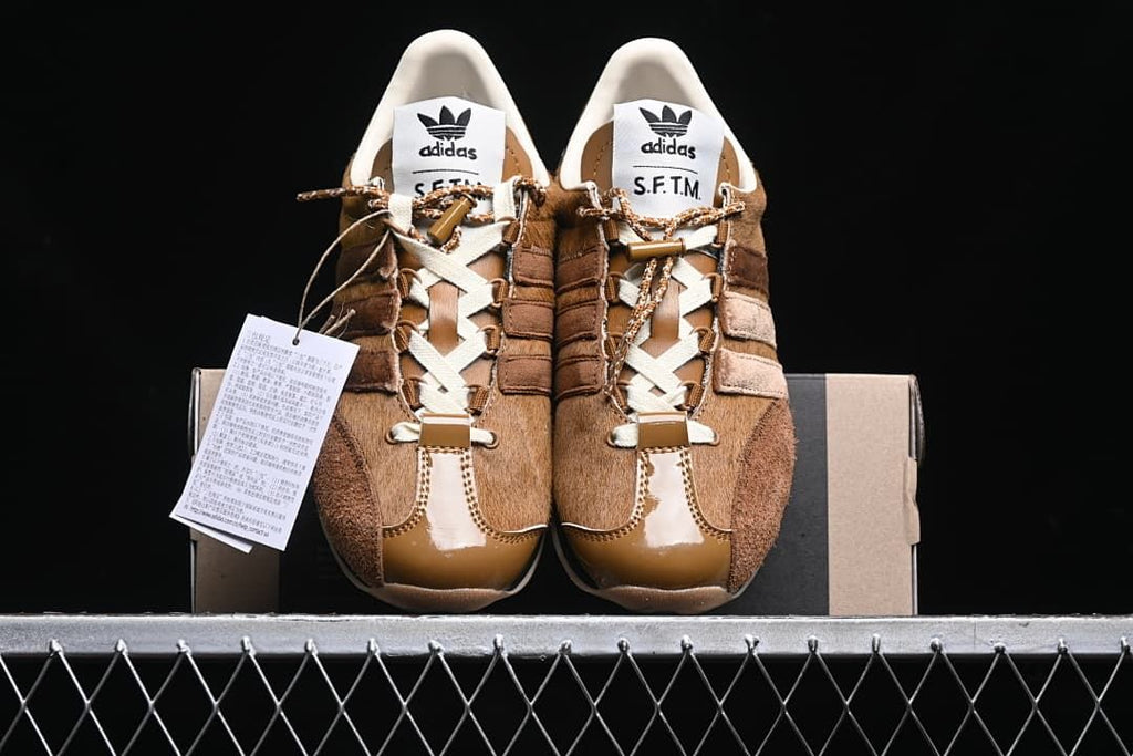 Front view of the pair showing toe panels, laces and tongue labels