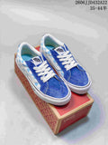 Pair of blue and white checkerboard Vans low-top sneakers displayed on a shoe box