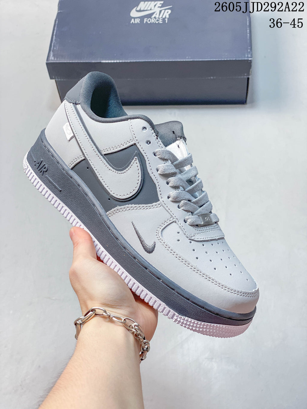 Several low-top sneakers in different colorways arranged together