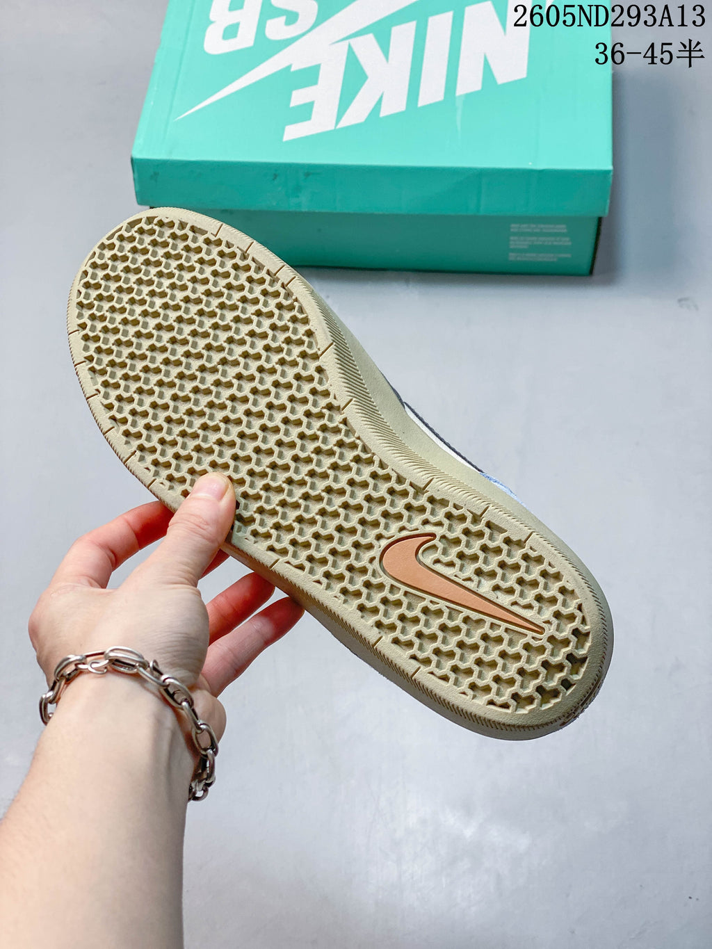 Close view of the gum-colored outsole and its patterned tread.
