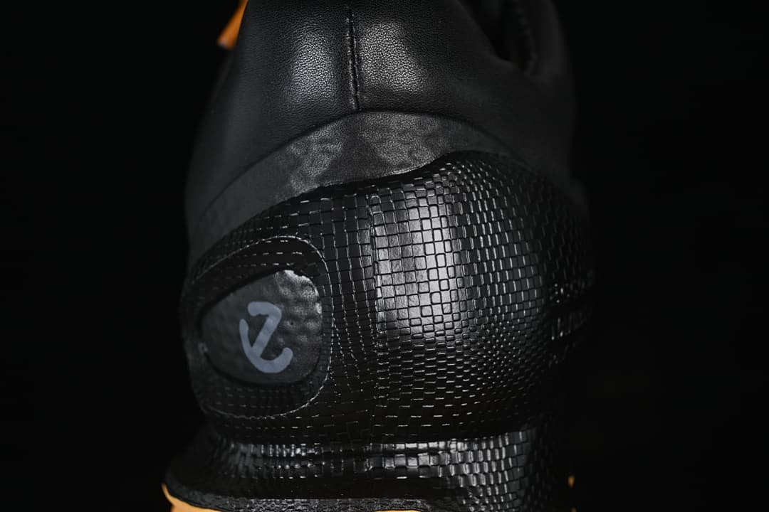 Close-up of the textured black heel panel and logo detail