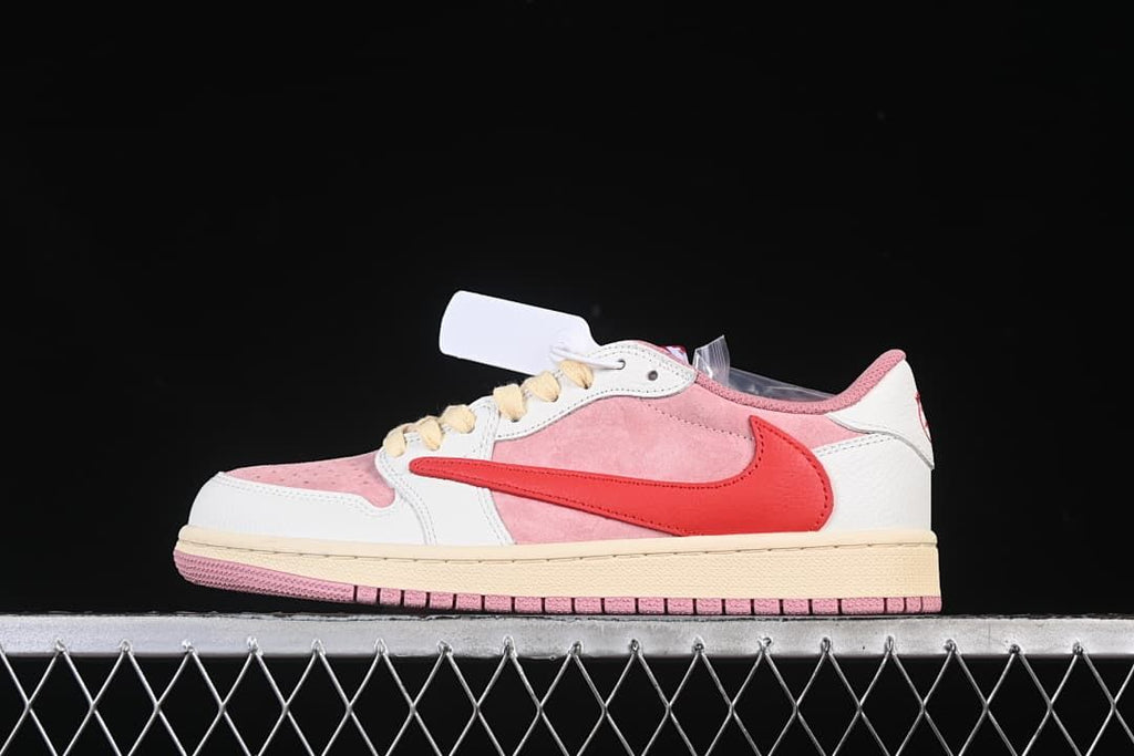 Side profile of pink, white, and red low-top sneaker