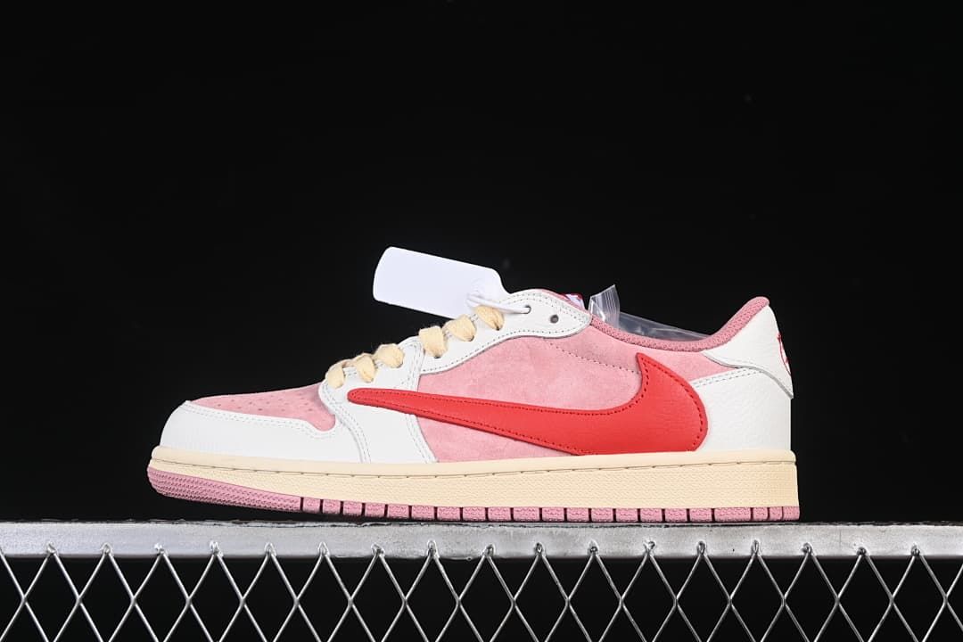 Side profile of pink, white, and red low-top sneaker