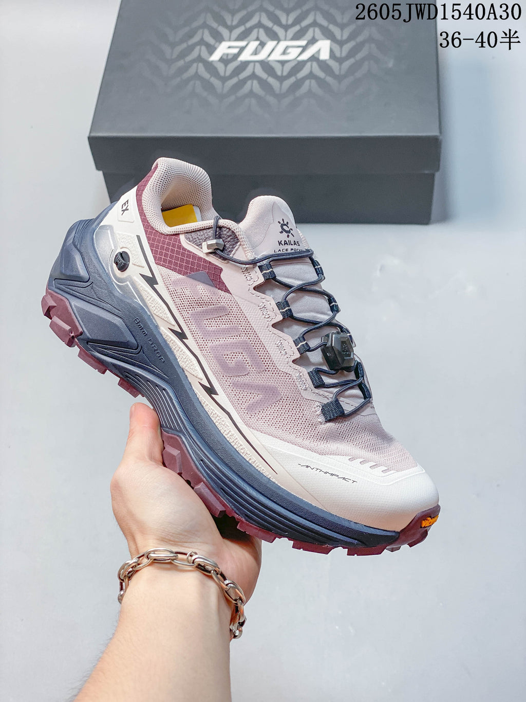 White Kailas FUGA low-top shoe with lime-green laces and a purple-and-green sole.