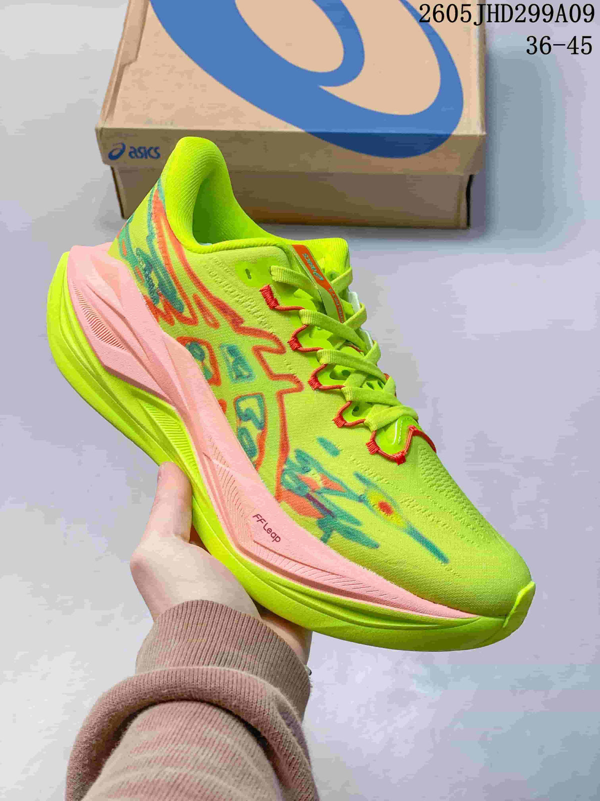 Neon green ASICS Superblast 3 running shoe with pink accents