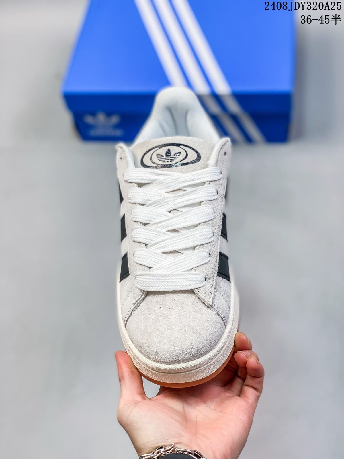 Front view of a light gray Adidas Campus 00s sneaker with white laces